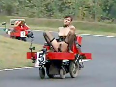 Girls racing around a track while dildo fucked
