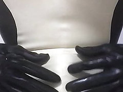 Catsuit handjob wearing latex sheath inside