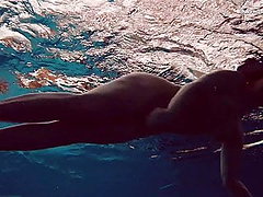 Big tits brunette babe Dashka swimming underwater