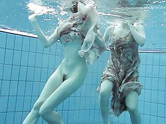 Two dressed beauties underwater – Netrebko and Poleshuk