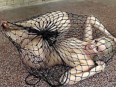 Obedient bitch sits stranded in fishnet and ready to fuck