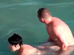 Curvy couple has hardcore sex in the ocean