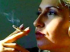 Sweet blonde is smoking in a sexy way