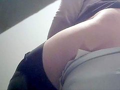 Toilet film of amazing pissing babe showing her ass