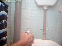 Perverted babe is peeing in the toilet