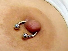 Dark-haired mature with piercing is fucking her puss