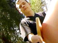 Outdoor gay spanking with nice red ass