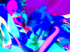 Surrealistic looking film with black light paint and lesbians